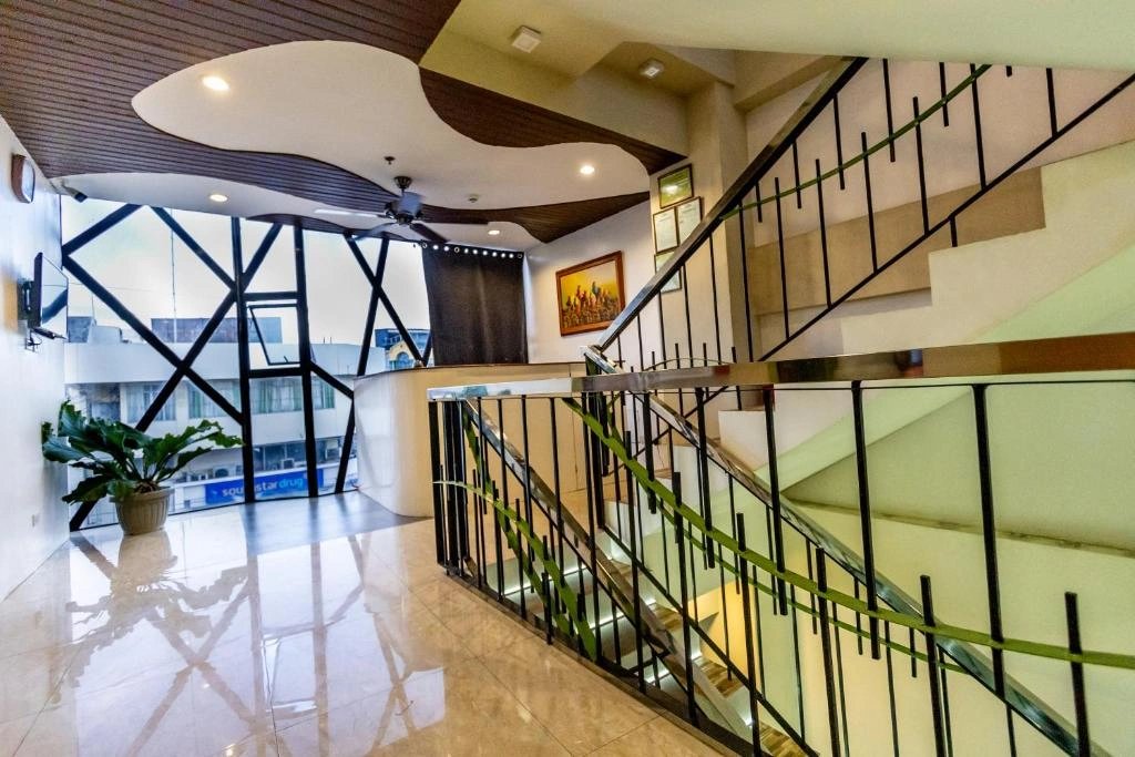 The entrance and staircase at Kayong’s Inn